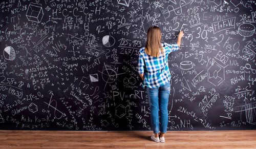 student-writing-on-chalkboard.jpg